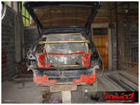 The first thing to do was to install the C-pillar part of the roll cage, to keep the rear end from deforming.