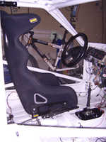Sideshot with seat, gearstick and lotsa loose wires.