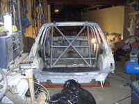 Rear shot, rollcage fitted inside car to make some space in the garage.